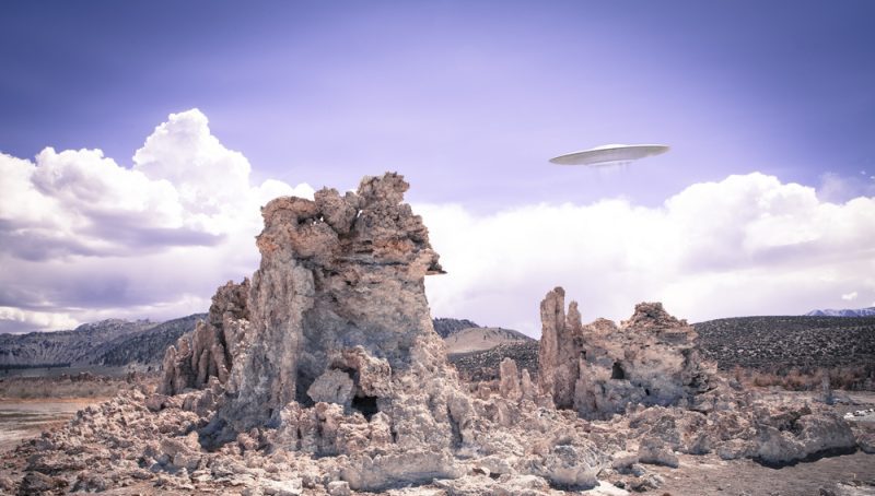 UFO spotted flying over desolate landscape